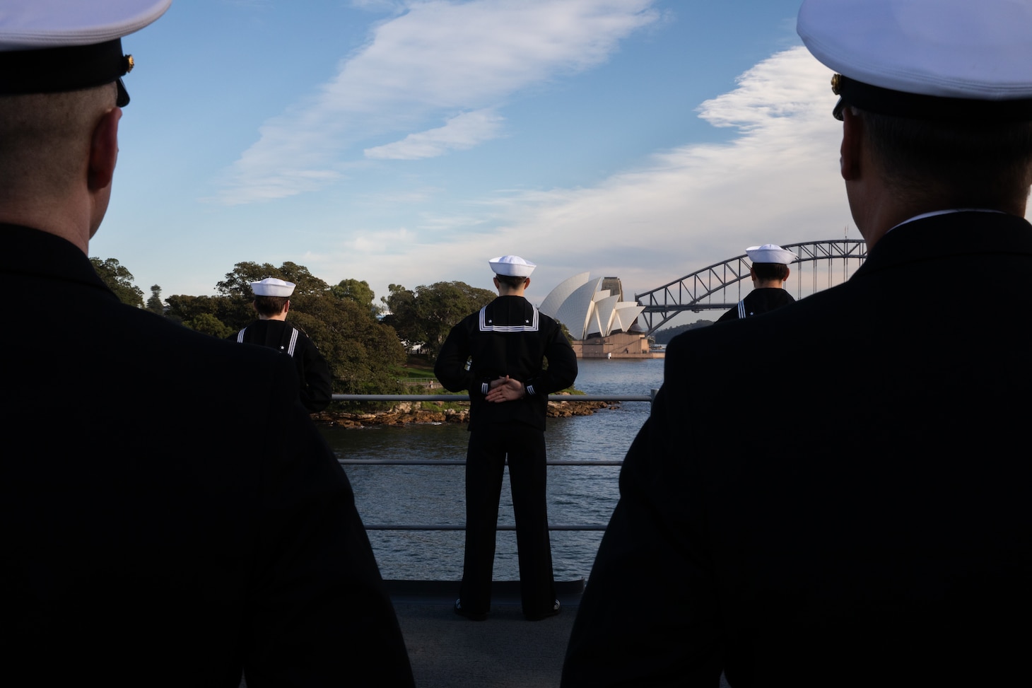SYDNEY, Australia (May 26, 2025) - Sailors assigned to the U.S. 7th Fleet flagship USS Blue Ridge (LCC 19) and 7th Fleet Staff man the rails while pulling into Sydney, Australia for a scheduled port visit, May 26, 2025.  7th Fleet is the U.S. Navy's largest forward-deployed numbered fleet, and routinely interacts and operates with allies and partners in preserving a free and open Indo-Pacific region. (U.S. Navy photo by Lt.j.g. Sarah Merrill)