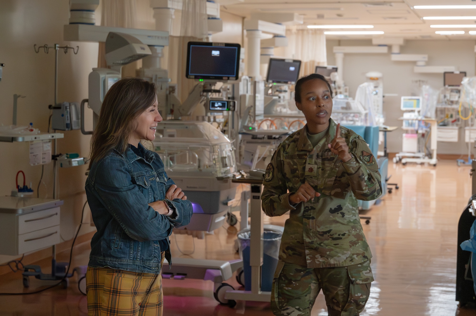 The spouse of the PACAF commander tours a NICU during an immersion tour.