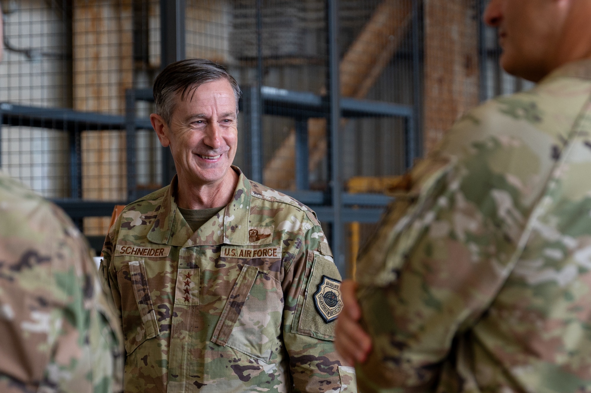 The PACAF commander smiles during an immersion tour.