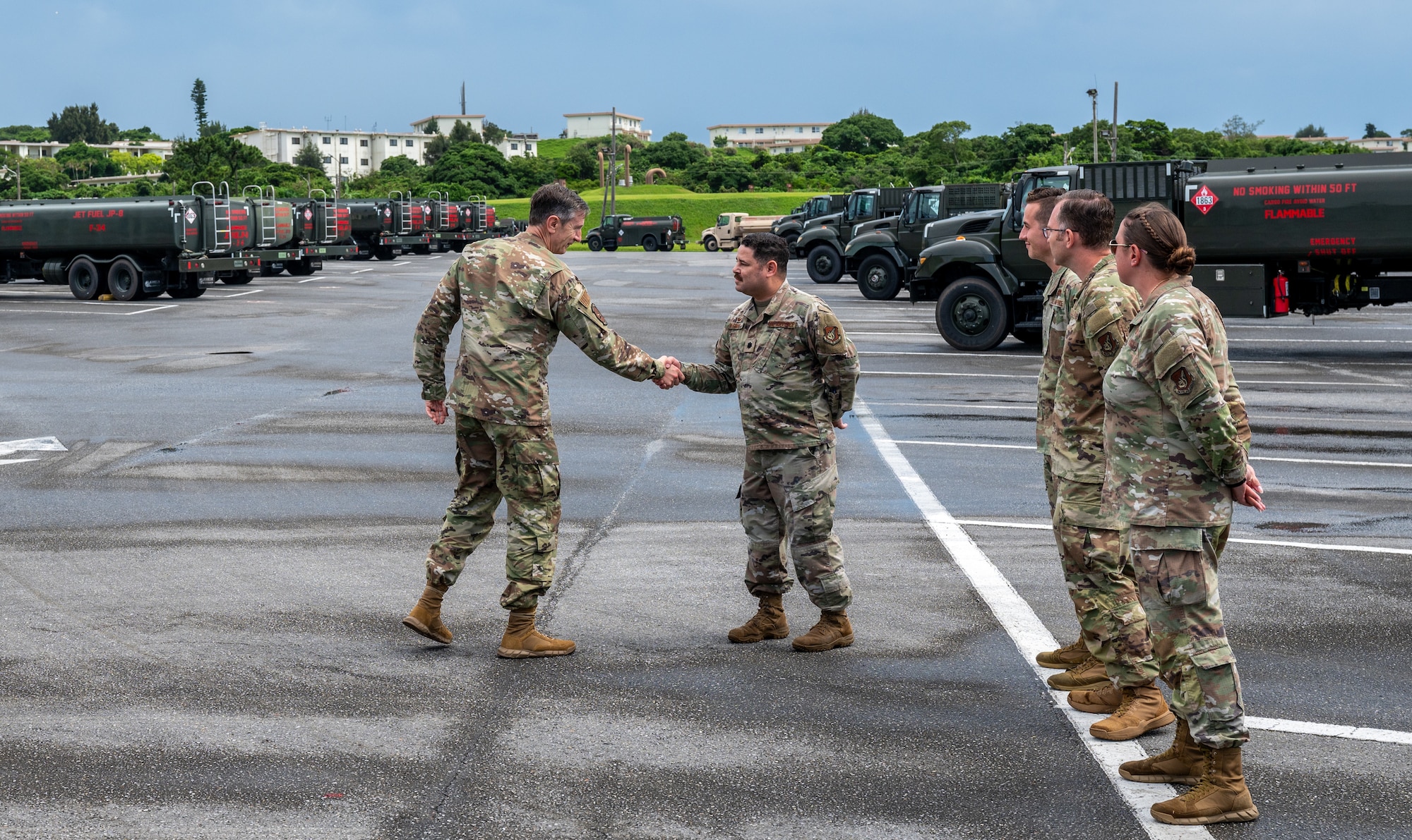 Fuels Airmen greet the PACAF commander during an immersion tour.