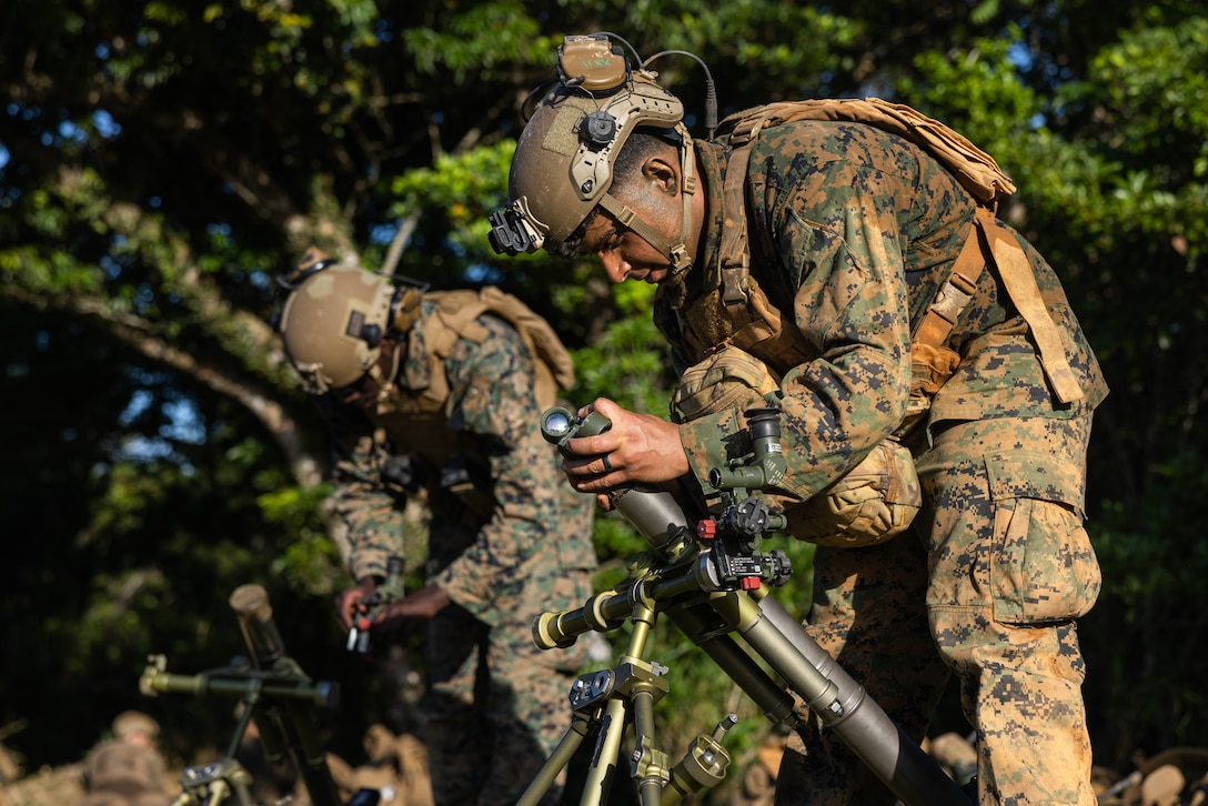 U.S. Marine Corps Cpl. Juan Garcia employs an M224 60mm mortar during a field training exercise at the Central Training Area, Camp Hansen, Okinawa, Japan, May 14, 2025. The FTX allowed Marines to build tactical proficiency in support of expeditionary advanced base operations. Garcia, a native of the Dominican Republic, is a mortarman with 12th Littoral Combat Team, 12th Marine Littoral Regiment, 3d Marine Division. (U.S. Marine Corps photo by Lance Cpl. Rodney Frye)