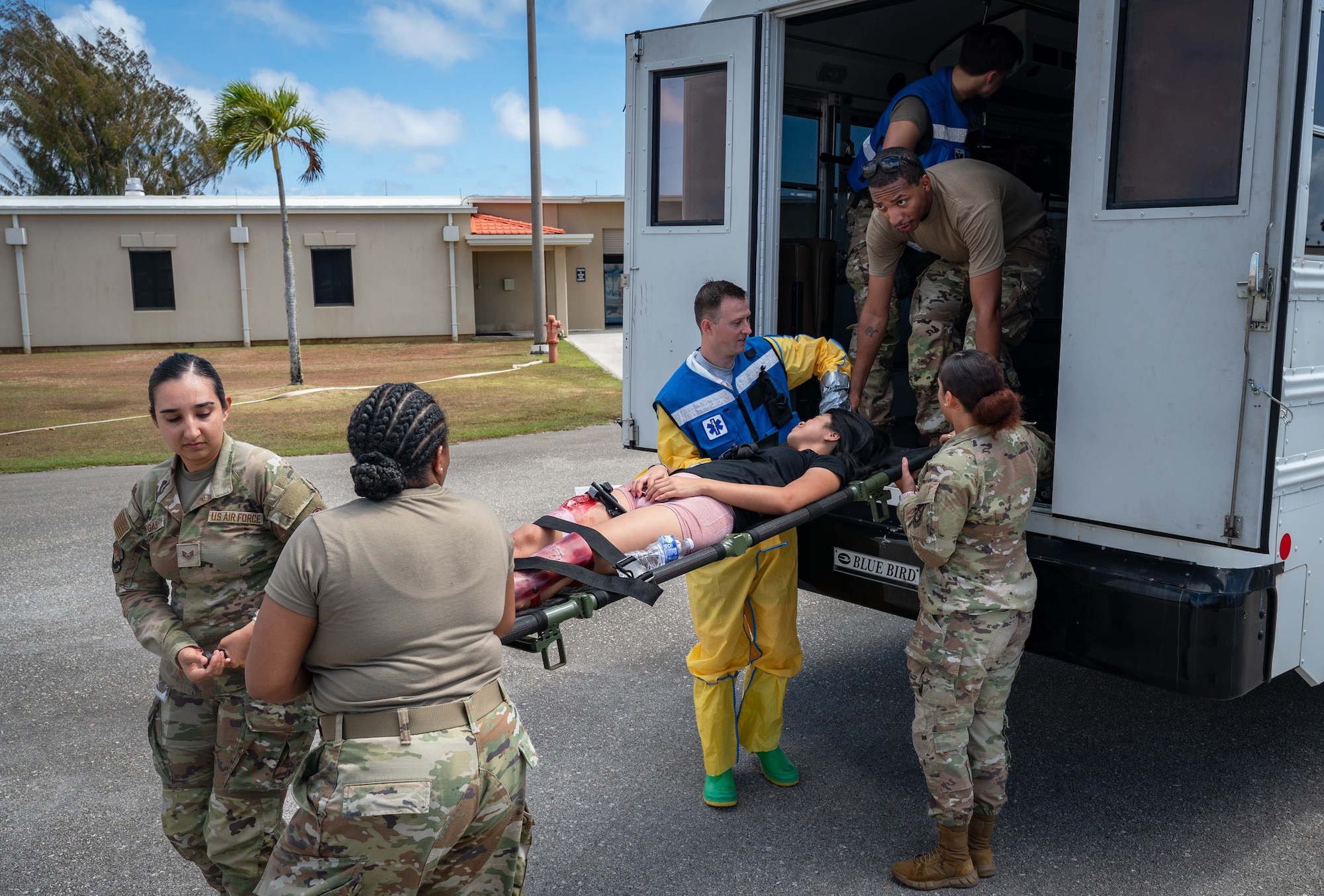36th Medical Group Airmen unload simulated casualties from a medical bus during a Mass Casualty Exercise at Andersen Air Force Base, Guam, May 14, 2025. All MDG Airmen are trained for worst-case scenarios like a hostile attack. This means Airmen with primary duties like dentists, lab technicians, pharmacy techs, etc. also have their crisis response duties either serving as field response team members, decontamination team members, manpower and more. (U.S. Air Force photo by Staff Sgt. Pedro Tenorio)