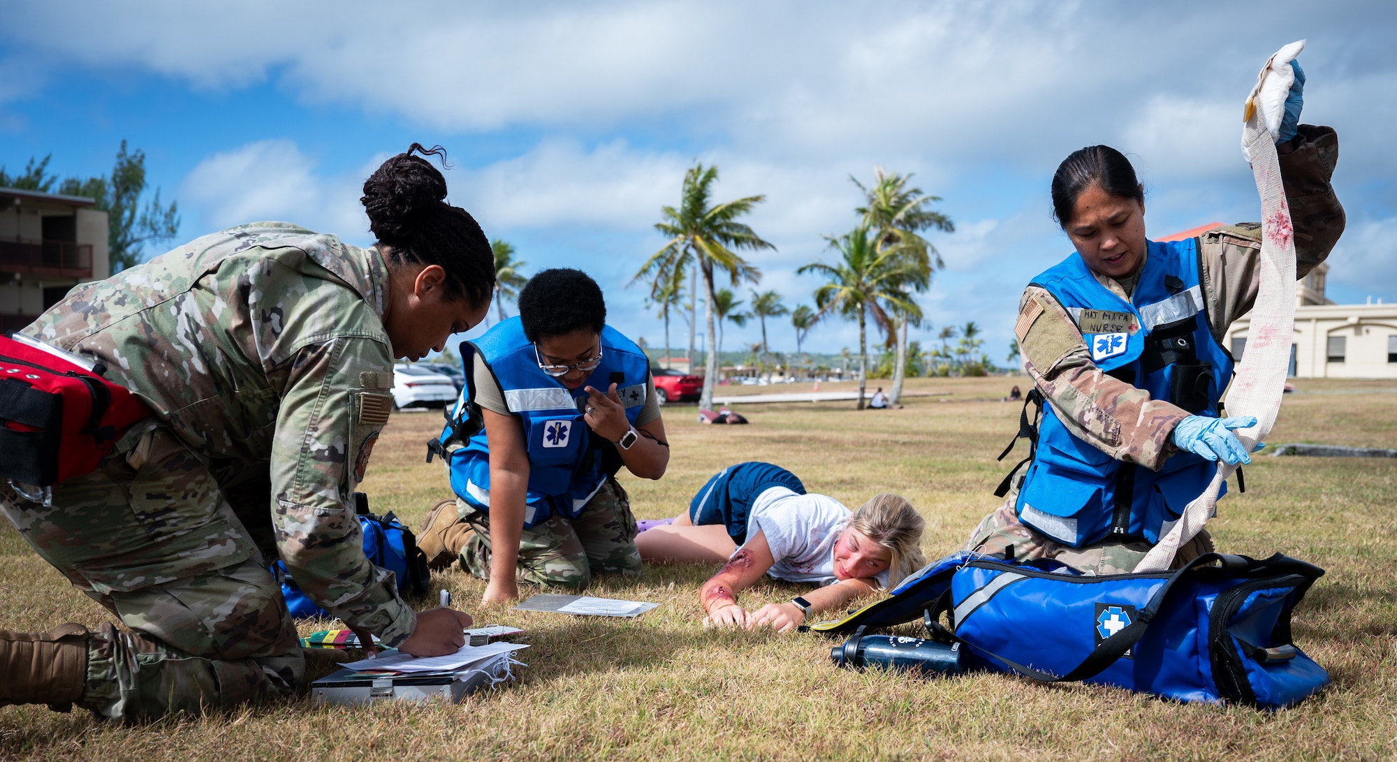 (From left) Staff Sgt. Erika Watson, Staff Sgt. Kyla Gulley and Major Parida Mata, field response team members, evaluate and aid a simulated casualty during an exercise at Andersen Air Force Base, Guam, May 16, 2025. The 36th Medical Group hosts many exercises to keep their Airmen ready to fight. This exercise simulated a hostile attack and the 36th MDG had to respond with limited manpower and resources. Each team was evaluated by the Wing Inspection Team and their findings would be brought to the chiefs of their respective divisions to assess and make changes where needed. (U.S. Air Force photo by Staff Sgt. Pedro Tenorio)