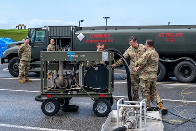 Fuels Airmen brief the PACAF commander on deployable equipment during an immersin tour.