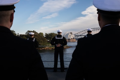 SYDNEY, Australia (May 26, 2025) - Sailors assigned to the U.S. 7th Fleet flagship USS Blue Ridge (LCC 19) and 7th Fleet Staff man the rails while pulling into Sydney, Australia for a scheduled port visit, May 26, 2025.  7th Fleet is the U.S. Navy's largest forward-deployed numbered fleet, and routinely interacts and operates with allies and partners in preserving a free and open Indo-Pacific region. (U.S. Navy photo by Lt.j.g. Sarah Merrill)