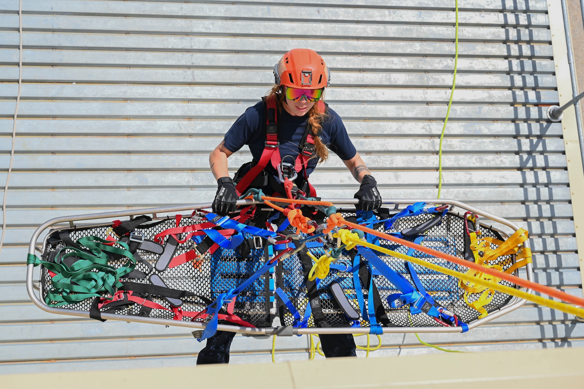 The Rapid Engineer Deployable Heavy Operational Repair Squadron Engineer Squadron, teaches students the importance of hooking the carabiner onto the victim at Andersen Air Force Base, Guam, May 7, 2025. This pick off rescue is performed in high angle environments, such as a cliff or a steep rock face.(U.S. Air Force photo by Airman 1st Class Joseph Maye)
