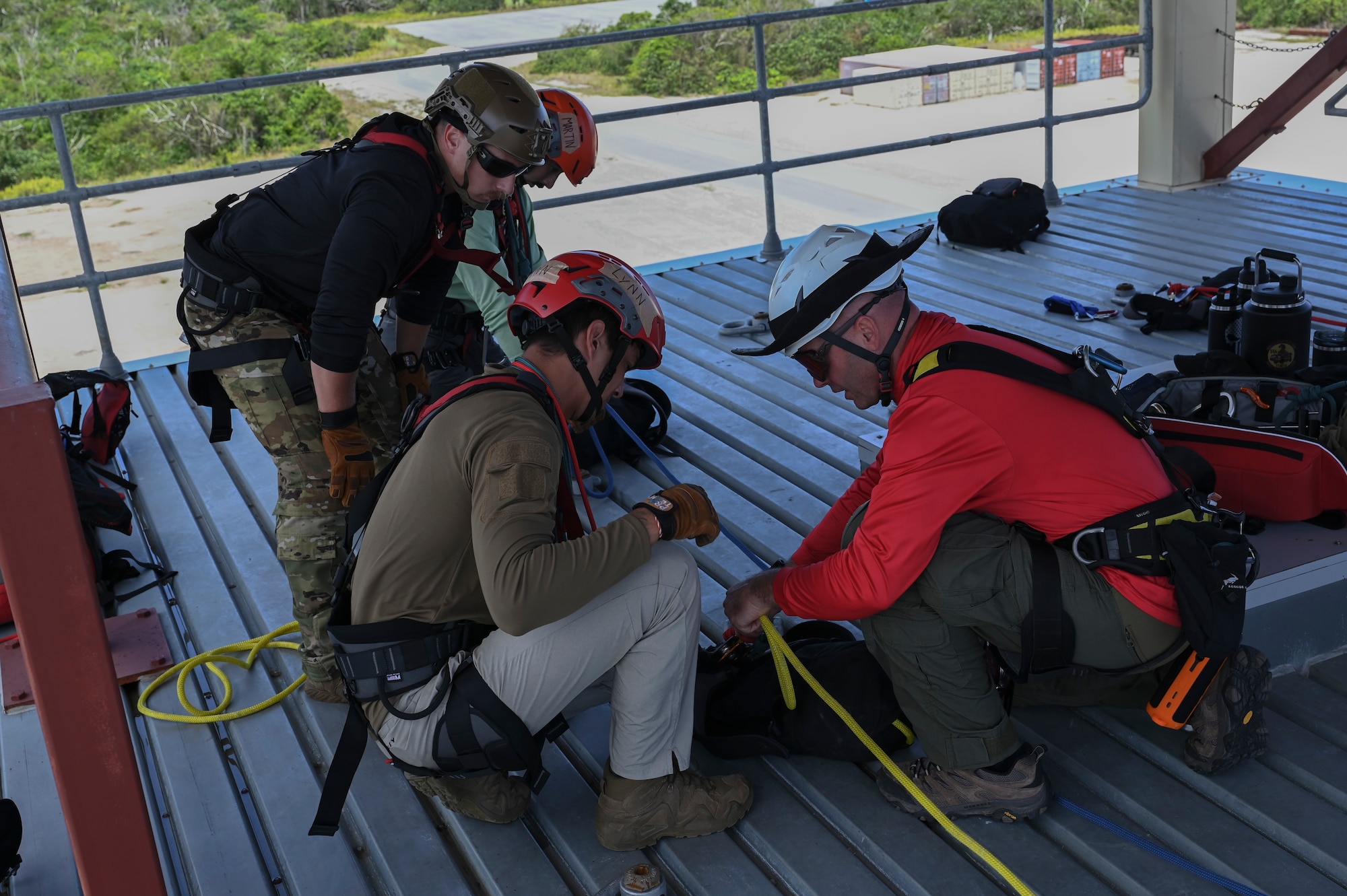 The Rapid Engineer Deployable Heavy Operational Repair Squadron Engineer Squadron, teaches students the importance of hooking the carabiner onto the victim at Andersen Air Force Base, Guam, May 7, 2025. This pick off rescue is performed in high angle environments, such as a cliff or a steep rock face.(U.S. Air Force photo by Airman 1st Class Joseph Maye)