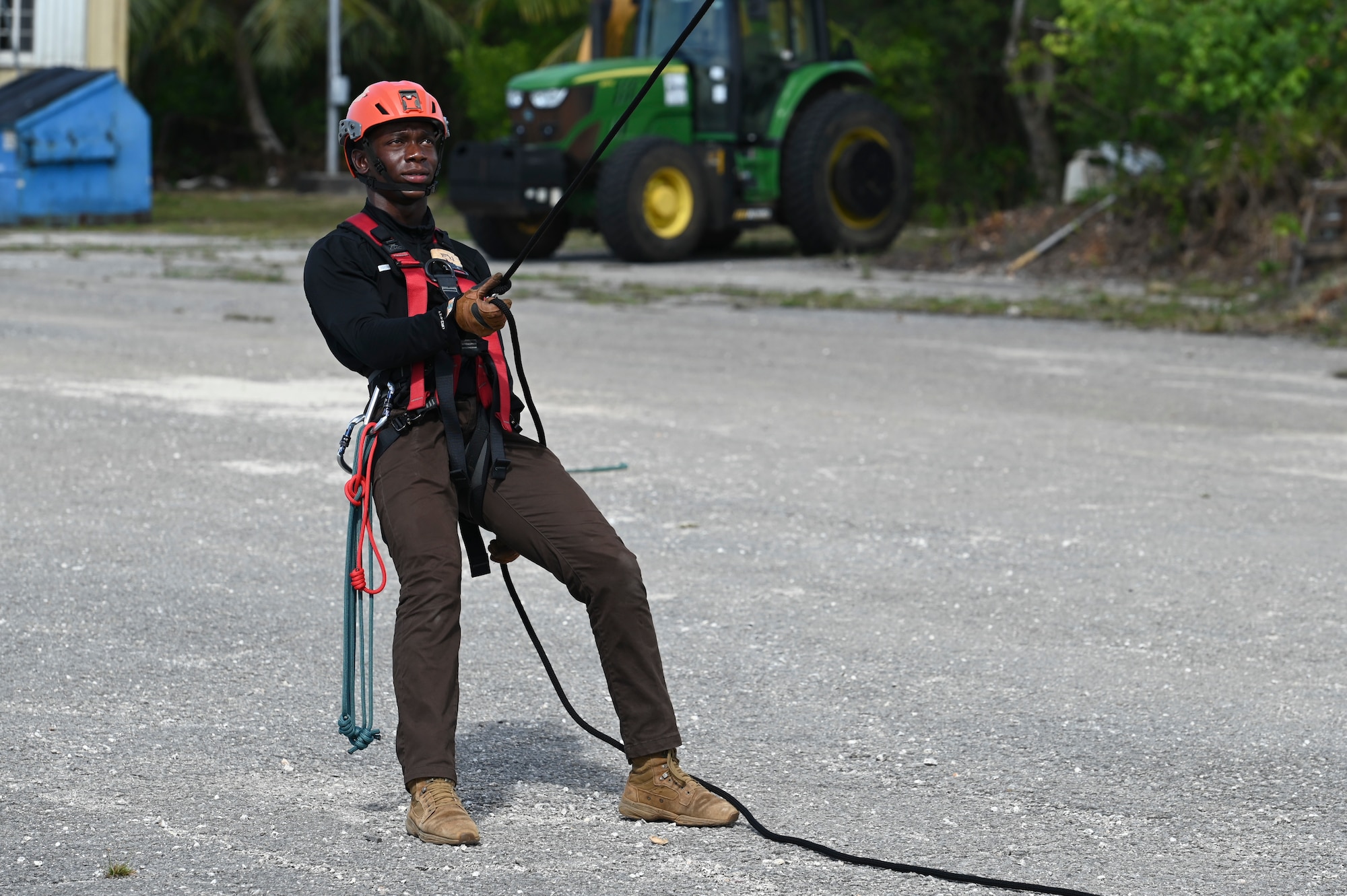 The Rapid Engineer Deployable Heavy Operational Repair Squadron Engineer Squadron, teaches students the importance of hooking the carabiner onto the victim at Andersen Air Force Base, Guam, May 7, 2025. This pick off rescue is performed in high angle environments, such as a cliff or a steep rock face.(U.S. Air Force photo by Airman 1st Class Joseph Maye)