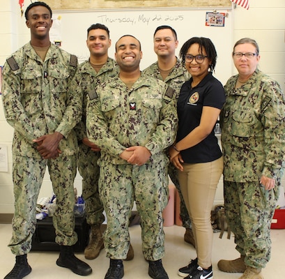 Sailors from Navy Medicine Readiness and Training Command (NMRTC) Patuxent River participated at the Captain Walter Francis Duke Elementary School’s Career Day on May 22, 2025, inspiring young students with interactive activities and insights into the world of Navy Medicine. Pictured from Left to Right: HM3 Rickey Samuels, HM2 Ethan Johnson, HM2 Luis Morales, HM1 Timothy Scull, HM2 Adia Moody, and HM1 Sandra Zdunowski.