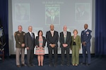 2025 DLA Hall of Fame inductees (from left) Air Force Lt. Gen. Earl Hedlund’s son, retired Navy Capt. John Hedlund; Larue “Scott” Rosbaugh’s widow, Kimberly Rosbaugh; Ronnie Favors; Jeffrey Curtis; and Linda Barnett