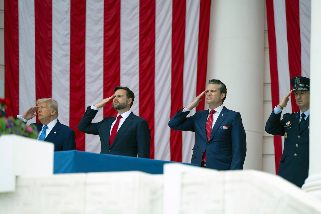 Nation's leaders salute while standing in front of an American flag.