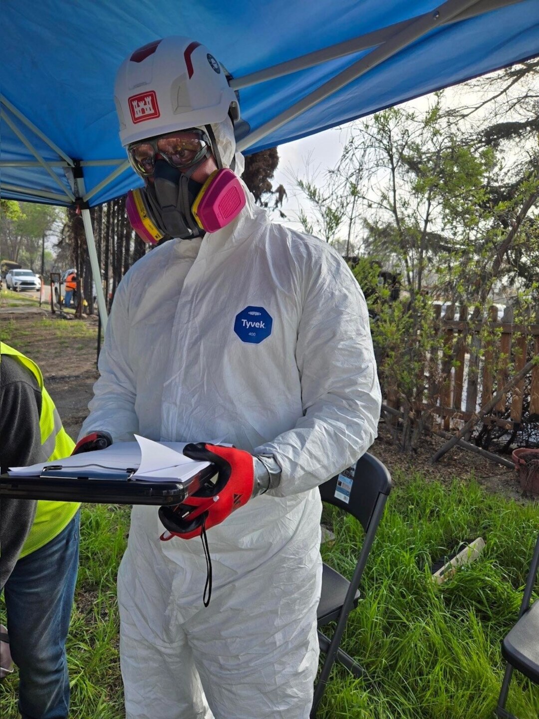 Man in safety gear while supporting disaster recovery.
