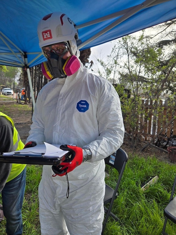 Man in safety gear while supporting disaster recovery.