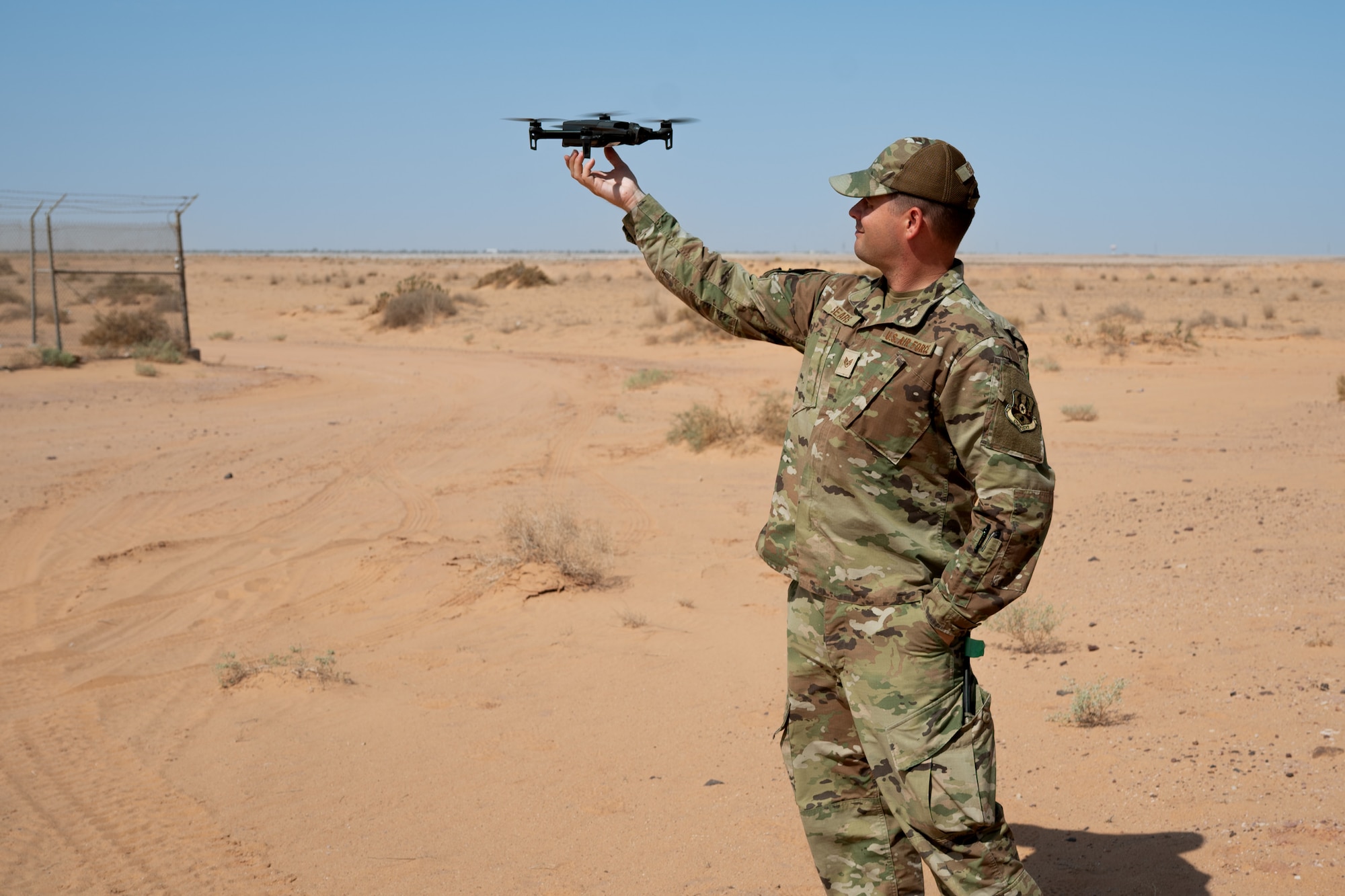Airman catches a drone in the air