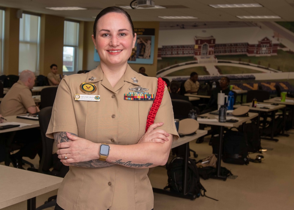 250512-N-GU344-1018 GREAT LAKES, Ill. (May 12, 2025) – Hospital Corpsman 1st Class Savannah Buza poses for a portrait photo at Recruit Training Command in Great Lakes. Boot camp is approximately nine weeks and all enlistees into the U.S. Navy begin their career at the command. More than 40,000 recruits train annually at the Navy's only boot camp. (U.S. Navy photo by Mass Communication Specialist 1st Class John Suits)