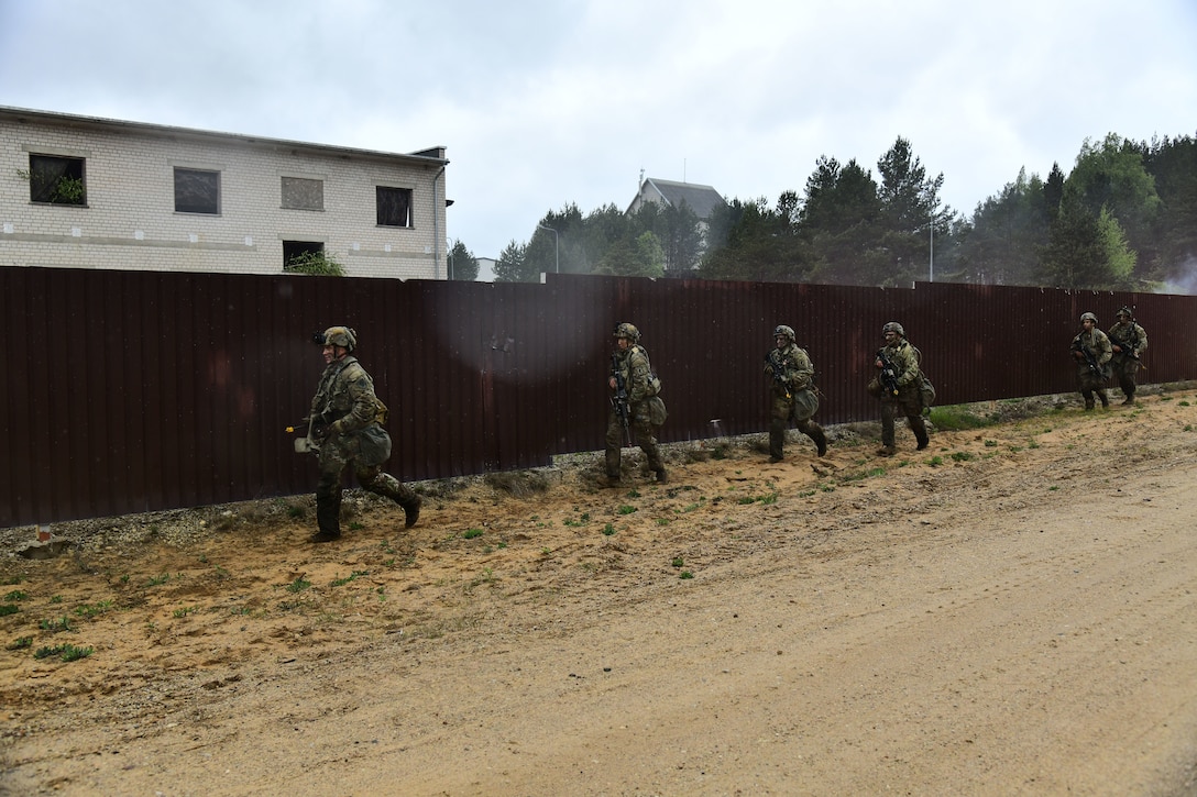 U.S. and French soldiers conduct a joint CBRN and Military Operation Urban Terrain (MOUT) training in Lithuania