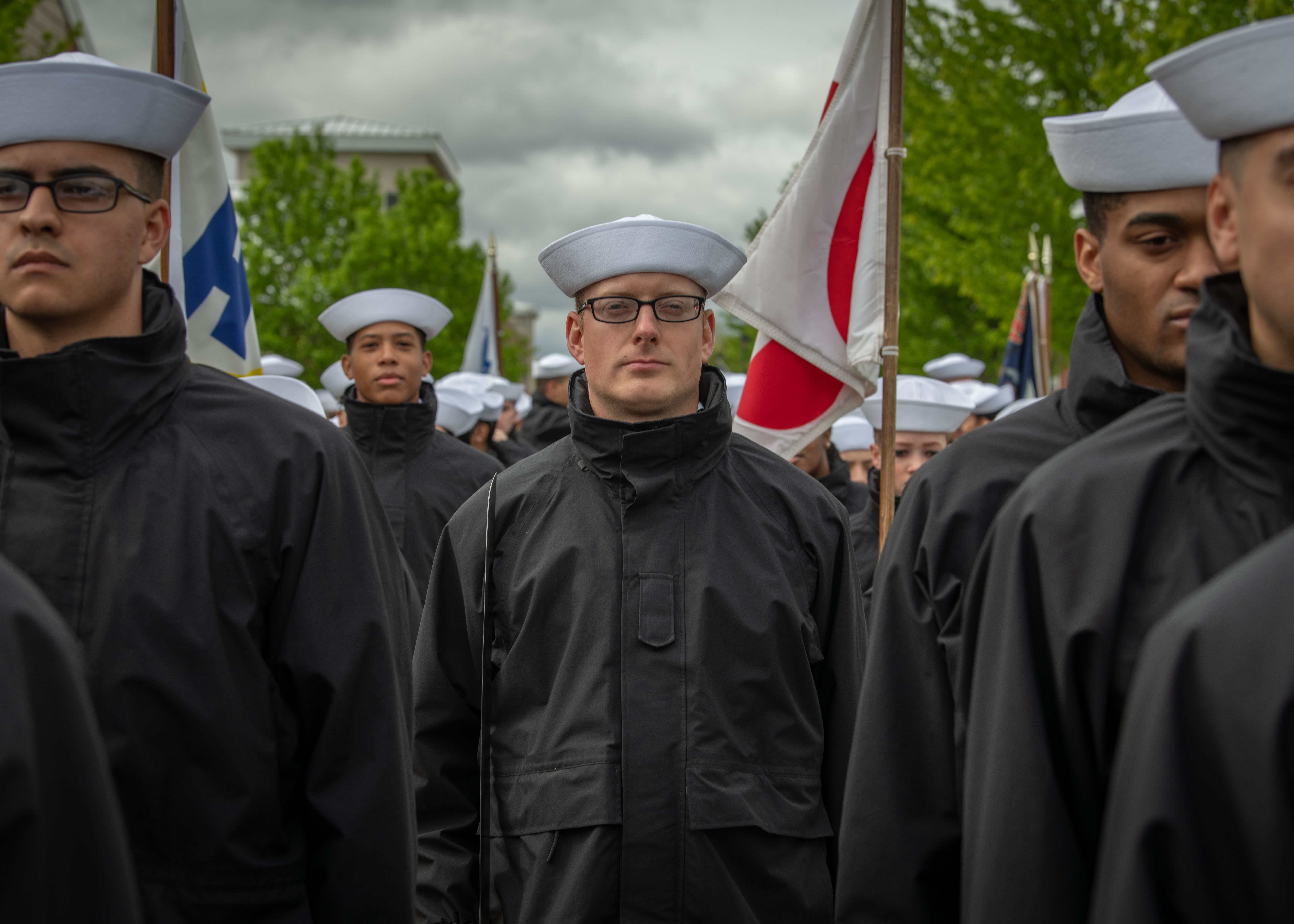Sailors stand in formation before their Pass-in-Review ceremony at U.S. Navy Recruit Training Command in Midway Ceremonial Drill Hall. More than 40,000 recruits train annually at the Navy's only boot camp.