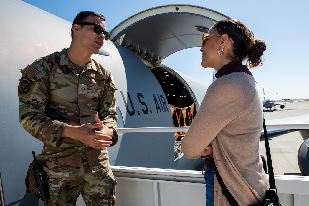 Airman speaks with local leadership during tour of aircraft on the flight line