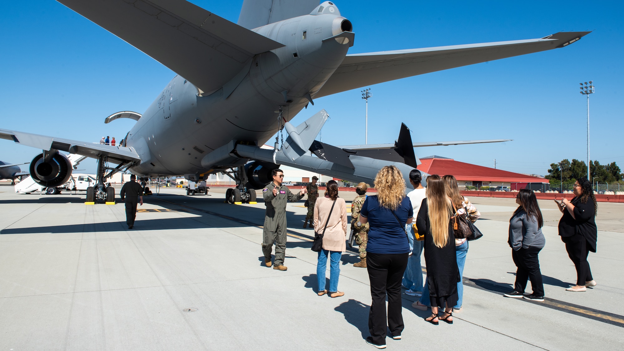 Local leadership tour an aircraft on the flight line