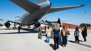 Local leadership tour an aircraft on the flight line