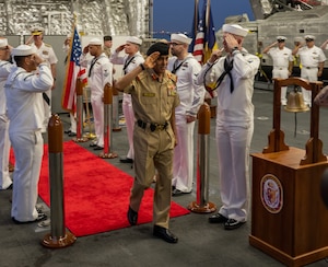 Lt. Gen. Theyab bin Saqr Al Nuaimi, Chief of Staff of the Bahrain Defence Force, is piped aboard the littoral combat ship USS Canberra (LCS 30) during a visit to the ship at Naval Support Activity Bahrain, May 26. Canberra, an Independence variant of LCS, is deployed to the region to maintain regional maritime security in the Middle East region.