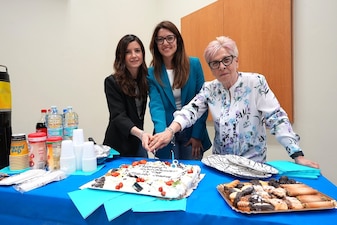 250522-N-DY427-5490 SIGONELLA, Italy. (May 21, 2025) Nellie Barone, Ilenya Llardo, and Chiara Caputo, the most junior and senior Local National Civilian personnel present at the event, assigned to U.S. Navy Medicine and Readiness Training Command (NMRTC) Sigonella, cut the cake during the Civilian Resource Fair. The command-wide event celebrated the unwavering dedication of more than 120 civilian team members, including Local Nationals (LNs) and General Schedule (GS) employees across three locations. Hosted by the Civilian Corps Board (CCB), the fair provided a vibrant space for connection, professional growth, and appreciation. Now in its eighth year, the Civilian Corps is a vital component of Navy Medicine’s enterprise-wide mission. Across the globe, civilian professionals bring continuity, expertise, and innovation to military treatment facilities, ensuring warfighters and their families receive consistent, high-quality care in every theater of operation. (U.S. Navy photo by Lieutenant Commander Brandi Gibson)