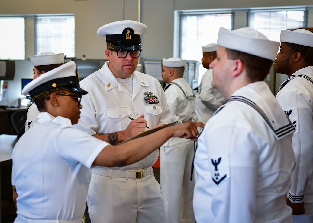 WASHINGTON (April 16, 2025) - Sailors assigned to Naval District Washington conduct a service dress white uniform inspection in preparation for the annual summer uniform shift. (U.S. Navy Photo by Mass Communication Specialist 1st Class Griffin Kersting)