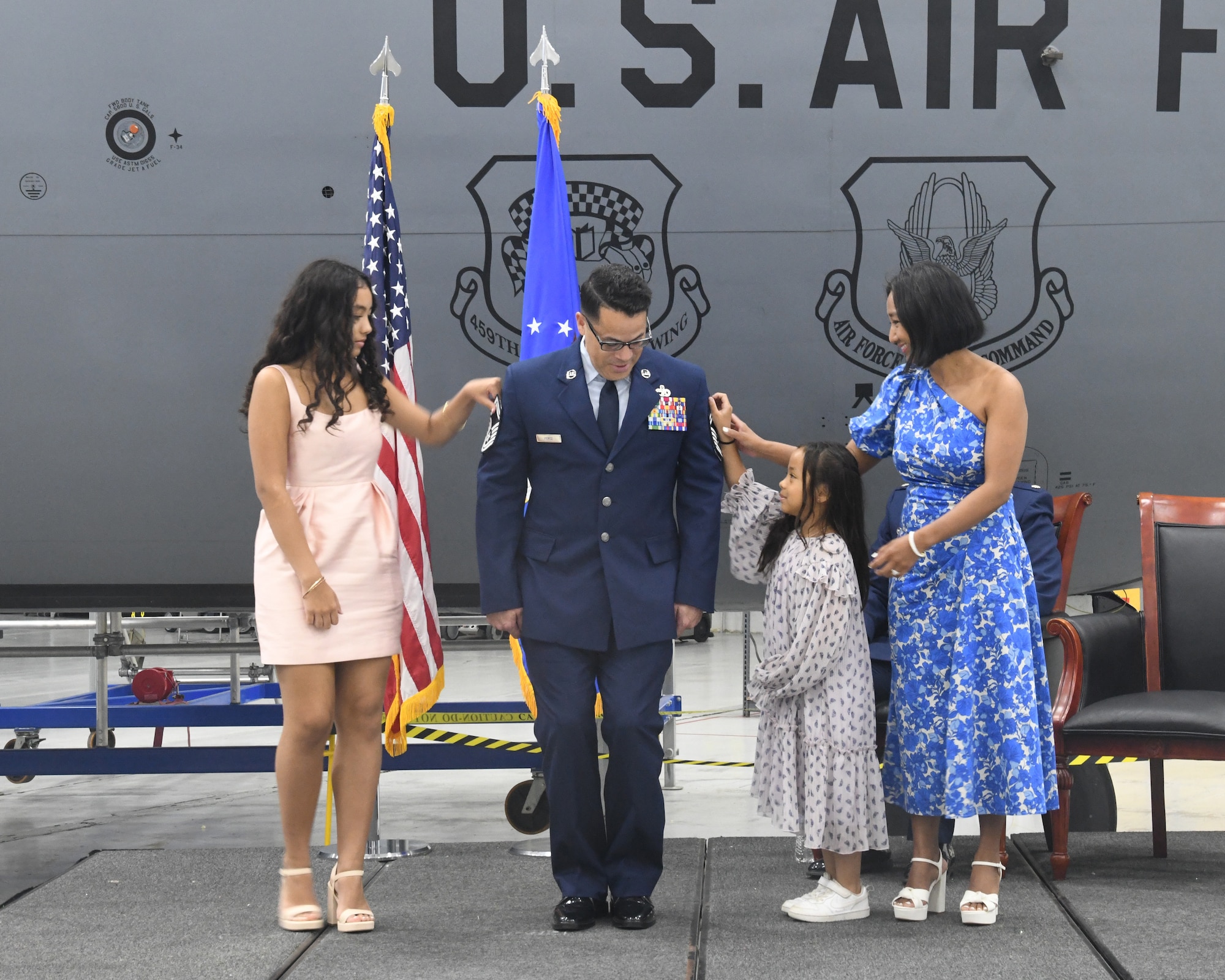 Senior Master Sgt. Erick Perez, 69th Aerial Port Squadron, promotes to the rank of Chief Master Sergeant during his promotion ceremony at the 459th Air Refueling Wing held on May 4, 2025. His family did the honors of pinning the rank on him, and Lt. Col. Edward Buck, 69th APS Commander, was the presiding official. (U.S. Air Force photo by Lt. Col. Timothy Smith)