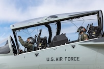 U.S. Air Force Lt. Gen. Brian S. Robinson, commander of Air Education and Training Command, made history as the first non-test pilot to fly the T-7A Red Hawk, while Lt. Col. Jonathan Aronoff, 416th Flight Test Squadron, instructed from the rear seat.  (U.S. Air Force photo / Jennifer Healy)
