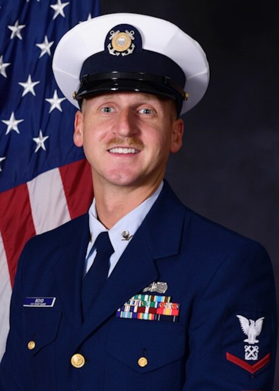 A man in uniform poses for a photo.
