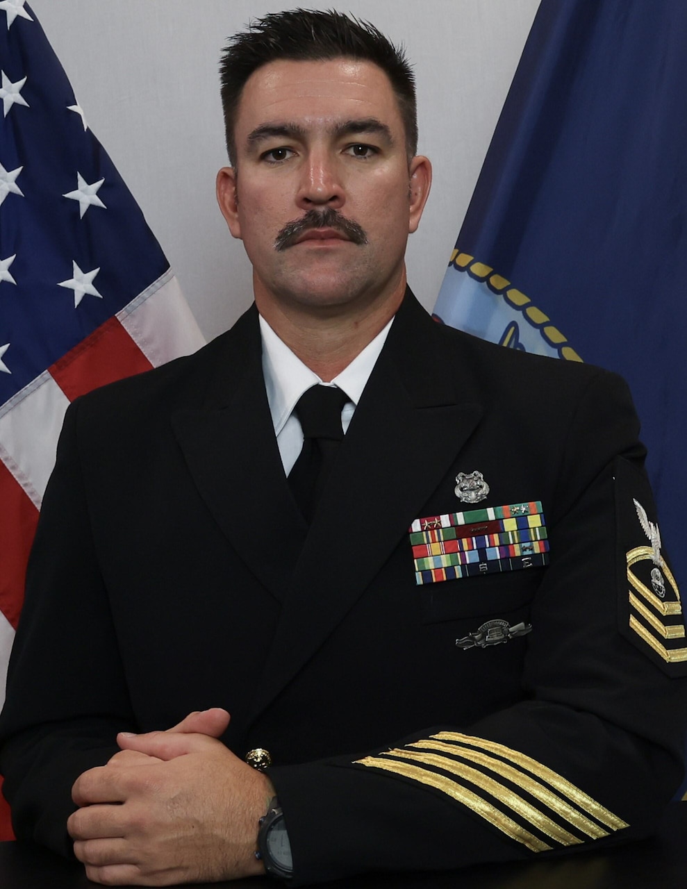 A man in uniform poses for a photo.