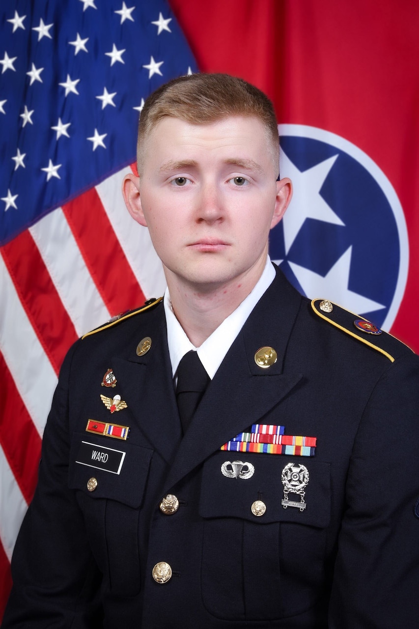 A man in uniform poses for a photo.