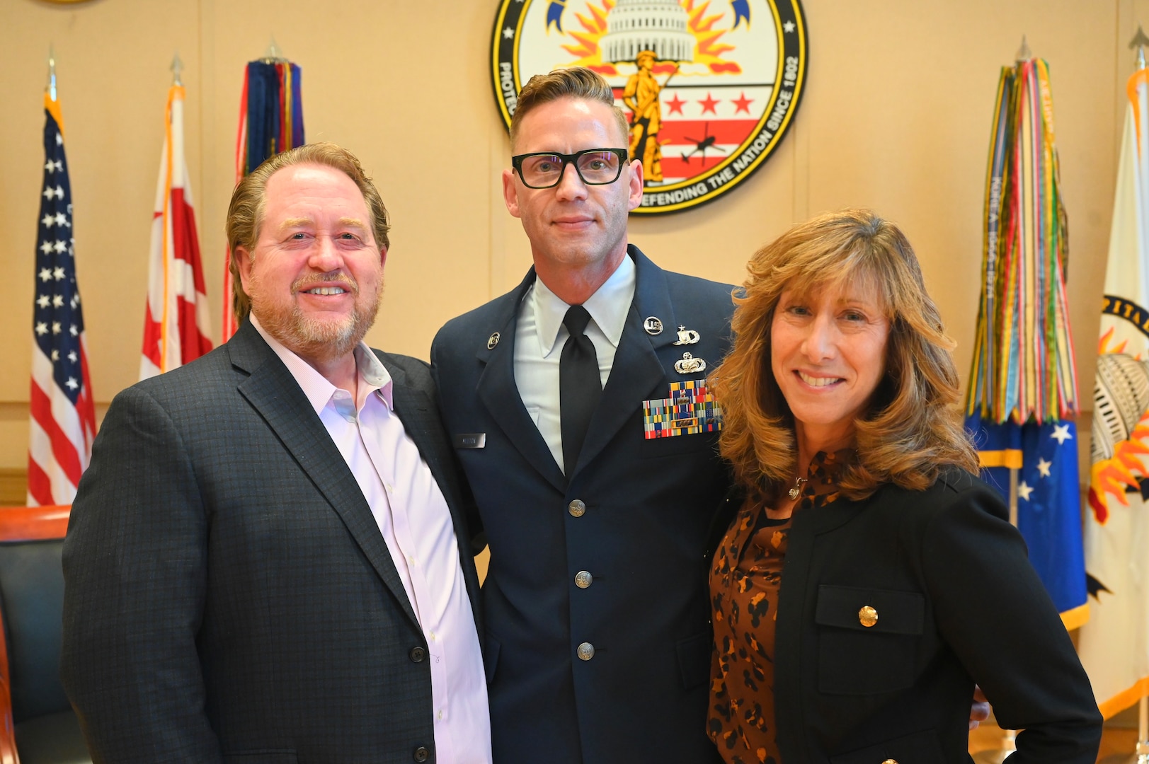 U.S. Air Force Master Sgt. Jason M. Melton, PA superintendent, Headquarters District of Columbia Air National Guard (HQ/DCANG-PA), and Dr. Christine Going, senior advisor for the VA's Food Security Office, stand for a photograph during a ceremony at the D.C. Armory, on Oct. 20, 2024. Recently, Dr. Going was recognized with the Employer Support of the Guard and Reserve (ESGR) Patriot Award for her support to the organization. The Patriot Award reflects the efforts made to support Citizen Airmen and Soldiers through a wide-range of measures including flexible schedules, time off prior to and after deployment, caring for families, and granting leaves of absence if needed.