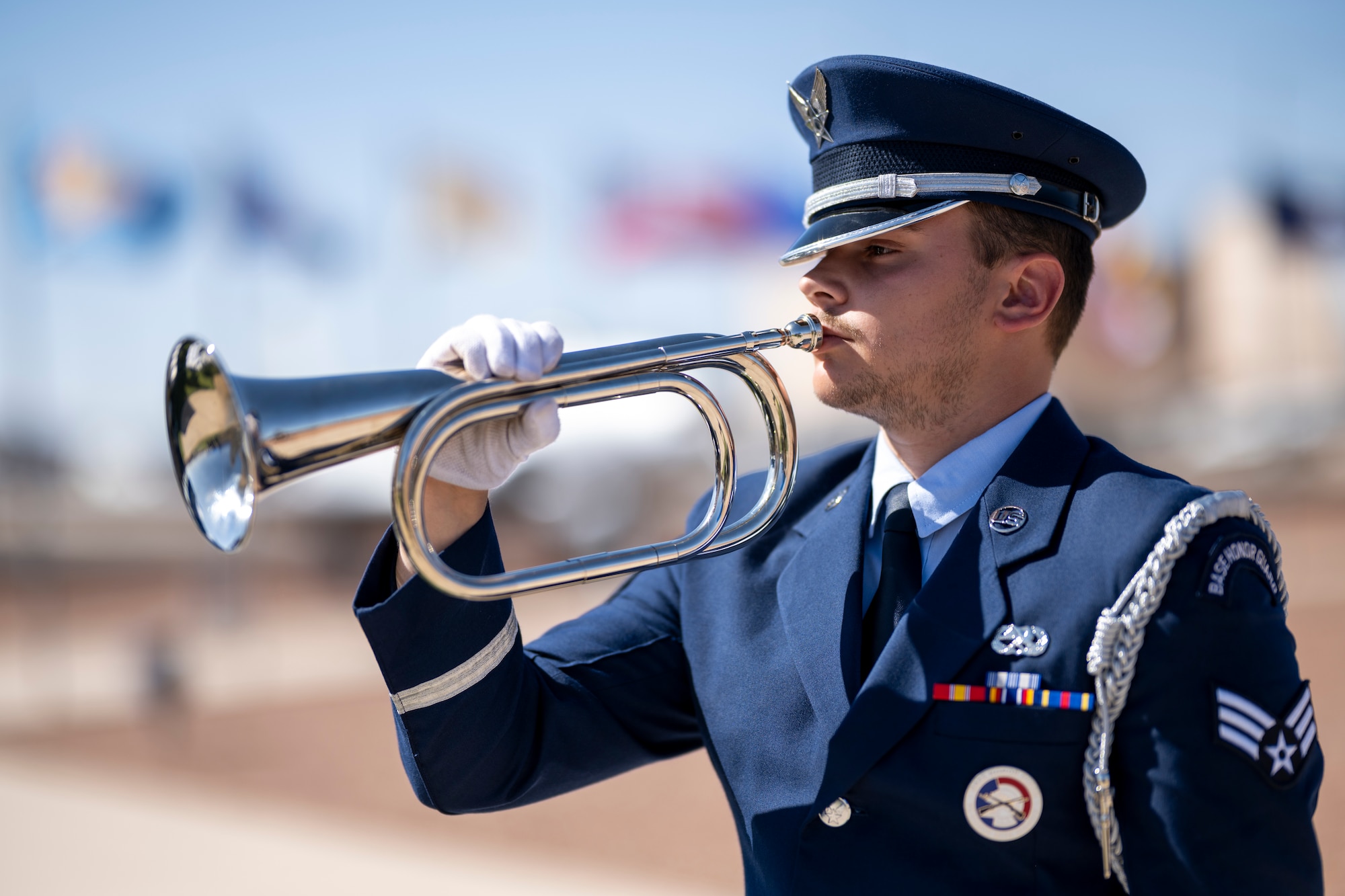 U.S. Air Force Senior Airman Justin Gillespie, 49th Force Support Squadron Steel Talons Honor Guard member, performs Taps during a Memorial Day ceremony at Holloman Air Force Base, New Mexico, May 22, 2025. Memorial Day originated as Decoration Day in the years following the Civil War, where the graves of fallen service members were adorned with flowers, and after gaining prominence over time, the tradition was officially established as a national holiday on the final Monday of May by Congress in 1968. (U.S. Air Force photo by Tech. Sgt. Victor J. Caputo)