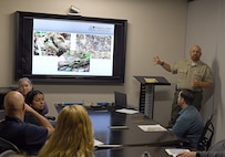 Jacob Doyle, park manager of Fort Frederick State Park in Washington County, Maryland, discusses snakes, spiders and ticks commonly found in Maryland during AMLC’s safety stand-down May 14 at Fort Detrick, Maryland.