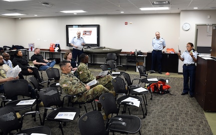 Members of the U.S. Coast Guard Auxiliary discuss boating and water recreation safety during AMLC’s safety stand-down May 14 at Fort Detrick, Maryland.