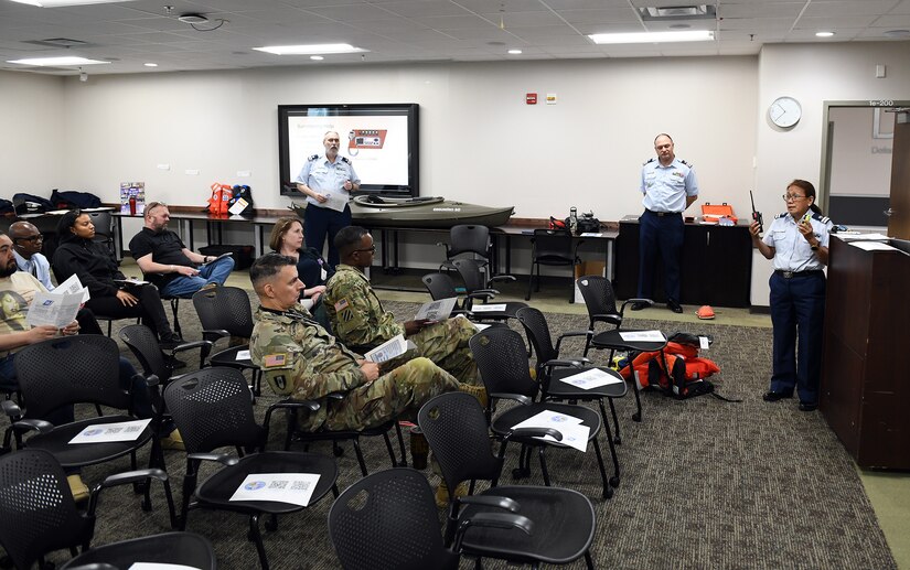 Members of the U.S. Coast Guard Auxiliary discuss boating and water recreation safety during AMLC’s safety stand-down May 14 at Fort Detrick, Maryland.