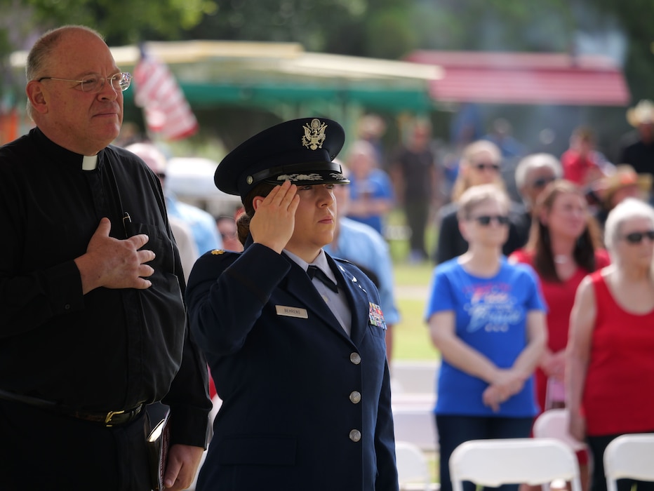 U.S. Air Force Maj. Cristina Behrens, 312th Training Squadron Director of Operations, salutes as the flag is raised at the 2025 Memorial Day Remembrance Ceremony at the Johnson’s Lawnhaven Memorial Garden, San Angelo, Texas, May 26, 2025. Memorial Day’s first national observance was in 1868.  (U.S. Air Force photo by Staff Sergeant Nathan Call)