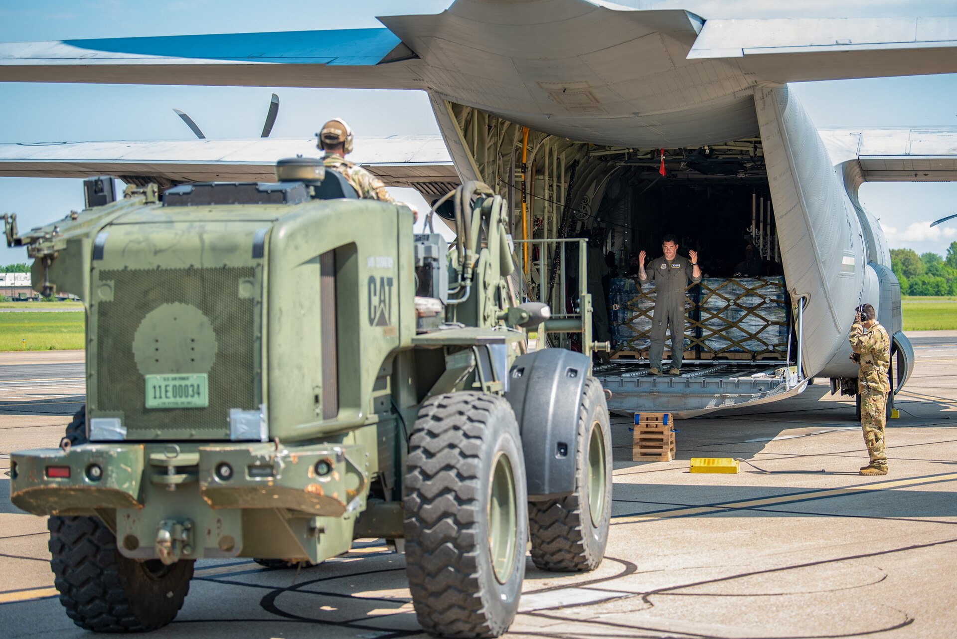 Members of the Kentucky Air National Guard’s 123rd Contingency Response Group offload pallets of water from a C-130J Super Hercules at Barkley Regional Airport in Paducah, Ky., May 14, 2025, in support of Exercise Grindstone, a major earthquake-response simulation.
