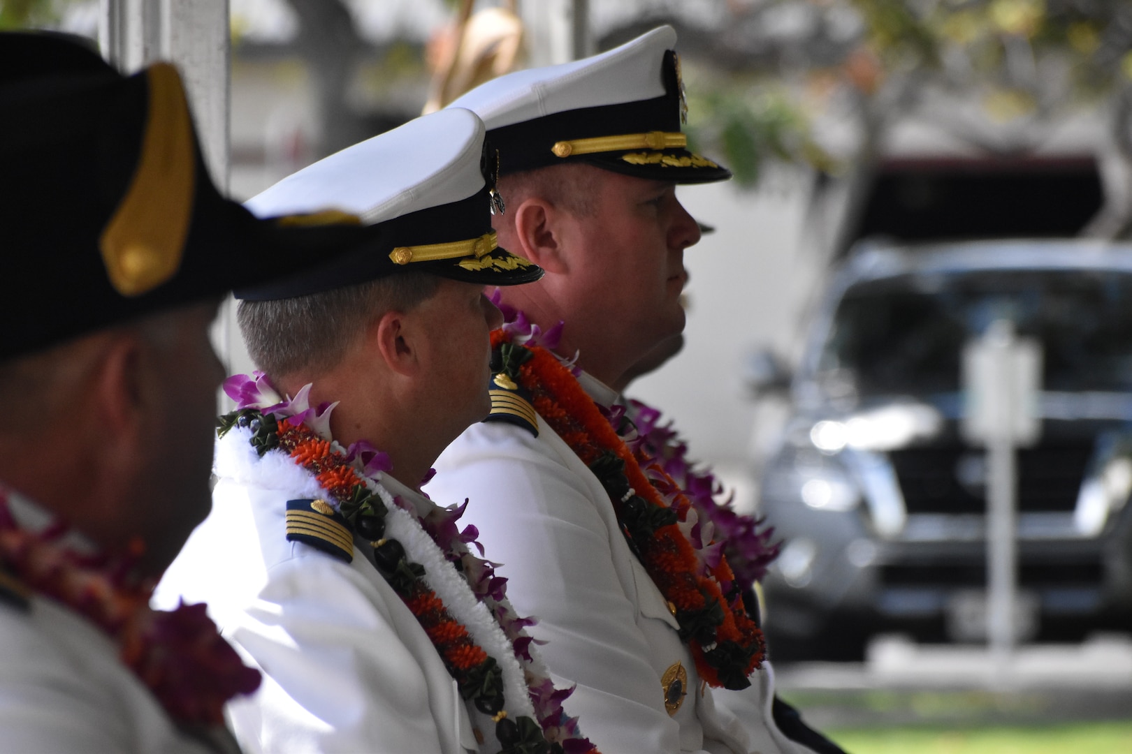 Capt. Matthew Rooney, commanding officer of U.S. Coast Guard Cutter Midgett (WMSL 757) and Capt. Brian Whisler, participate in the change of command ceremony in Honolulu, May 23, 2025. Commissioned in 2019, Midgett is named after the Midgett family and is one of two Coast Guard legend-class National Security Cutters homeported in Honolulu. (U.S. Coast Guard photo by Ens. Harlan Brady).