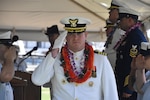 Capt. Brian Whisler, commanding officer of U.S. Coast Guard Cutter Midgett (WMSL 757) salutes during the change of command ceremony in Honolulu, May 23, 2025. Commissioned in 2019, Midgett is named after the Midgett family and is one of two Coast Guard legend-class National Security Cutters homeported in Honolulu. (U.S. Coast Guard photo by Ens. Harlan Brady).