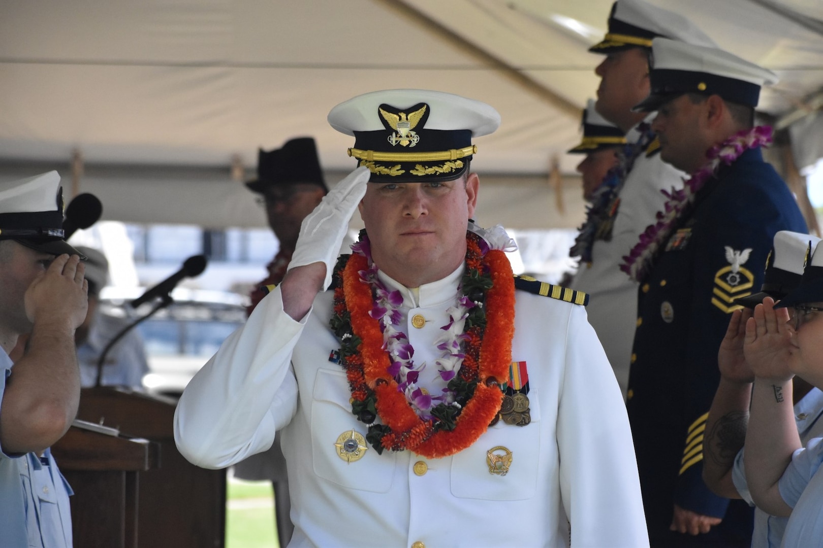 Capt. Brian Whisler, commanding officer of U.S. Coast Guard Cutter Midgett (WMSL 757) salutes during the change of command ceremony in Honolulu, May 23, 2025. Commissioned in 2019, Midgett is named after the Midgett family and is one of two Coast Guard legend-class National Security Cutters homeported in Honolulu. (U.S. Coast Guard photo by Ens. Harlan Brady).