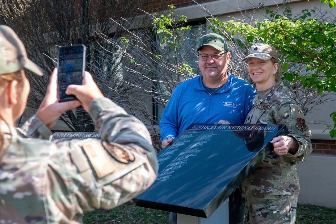 Current and former members of the 123rd Airlift Wing gather at the Kentucky Air National Guard Base in Louisville, Ky., April 12, 2025, for a ceremony unveiling a new marble tablet honoring retirees.