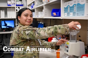 An Airman dispenses medication.