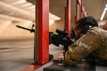 U.S. Air Force Senior Airman Deltron Banks, heavy equipment operator from the 5th civil engineering squadron, aims down range with the M4 at Minot Air Force Base, May 8, 2025. Banks trained on the M4 as a part of the Combat Arms Training and Maintenance course program designed to make him a more lethal Airman.(U.S. Air Force photo by Airman 1st Class Anthony Ramey)