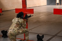 U.S. Air Force Senior Airman Dominique Henry, contracting specialist assigned to the 5th contracting squadron, fires shots down range at Minot Air Force Base, May 8, 2025. Henry was practicing shooting at targets as a part of the Combat Arms Training and Maintenance course, the full day of training makes her more is part of her requirements for a deployment. (U.S. Air Force photo by Airman 1st Class Anthony Ramey)