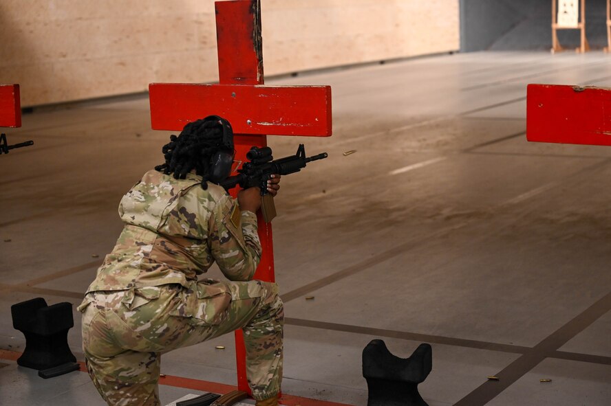 U.S. Air Force Senior Airman Dominique Henry, contracting specialist assigned to the 5th contracting squadron, fires shots down range at Minot Air Force Base, May 8, 2025. Henry was practicing shooting at targets as a part of the Combat Arms Training and Maintenance course, the full day of training makes her more is part of her requirements for a deployment. (U.S. Air Force photo by Airman 1st Class Anthony Ramey)