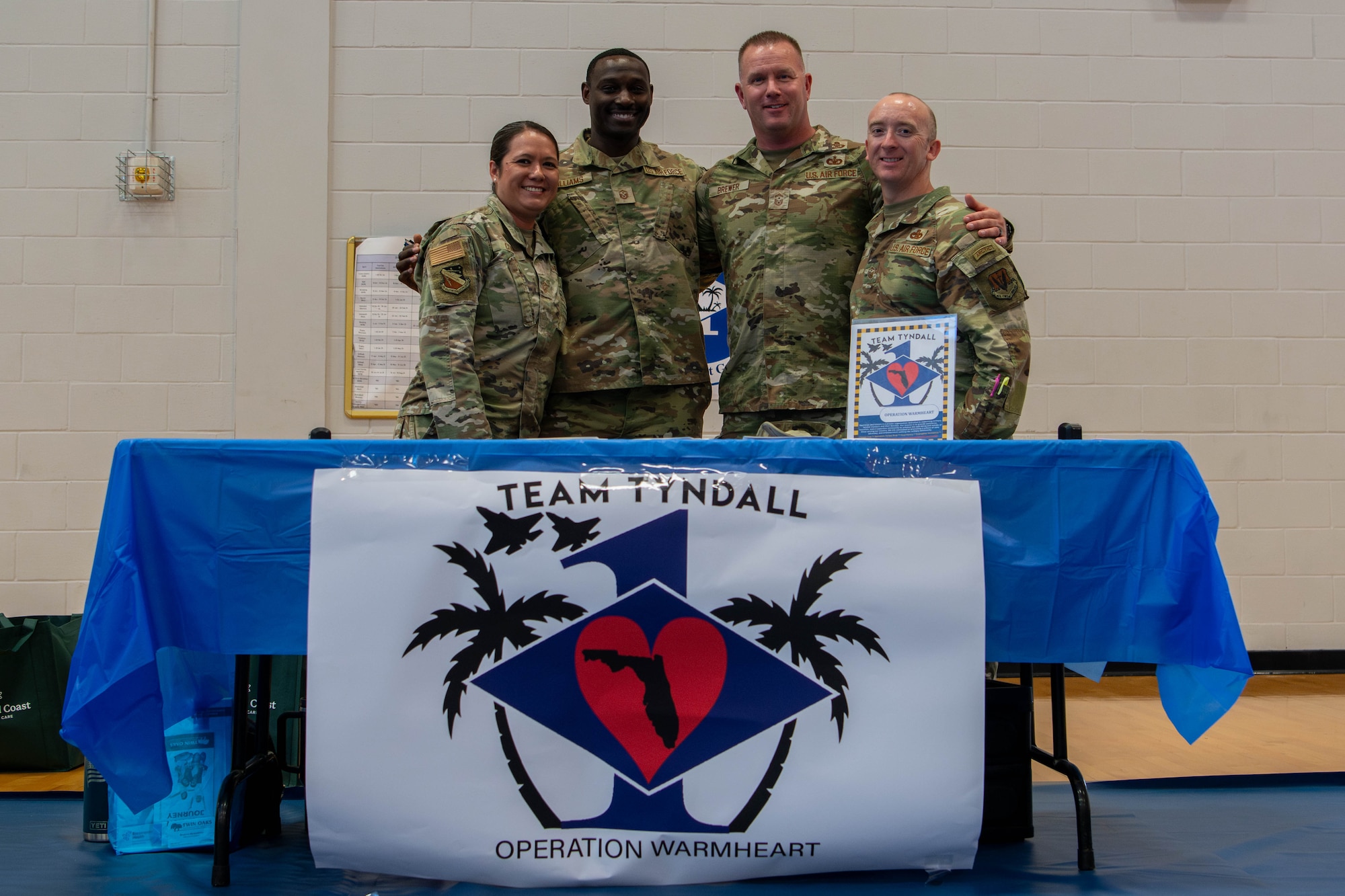 Members  of Operation Warm Heart pose for a photo during the Elevate Expo at Tyndall Air Force Base, Florida.