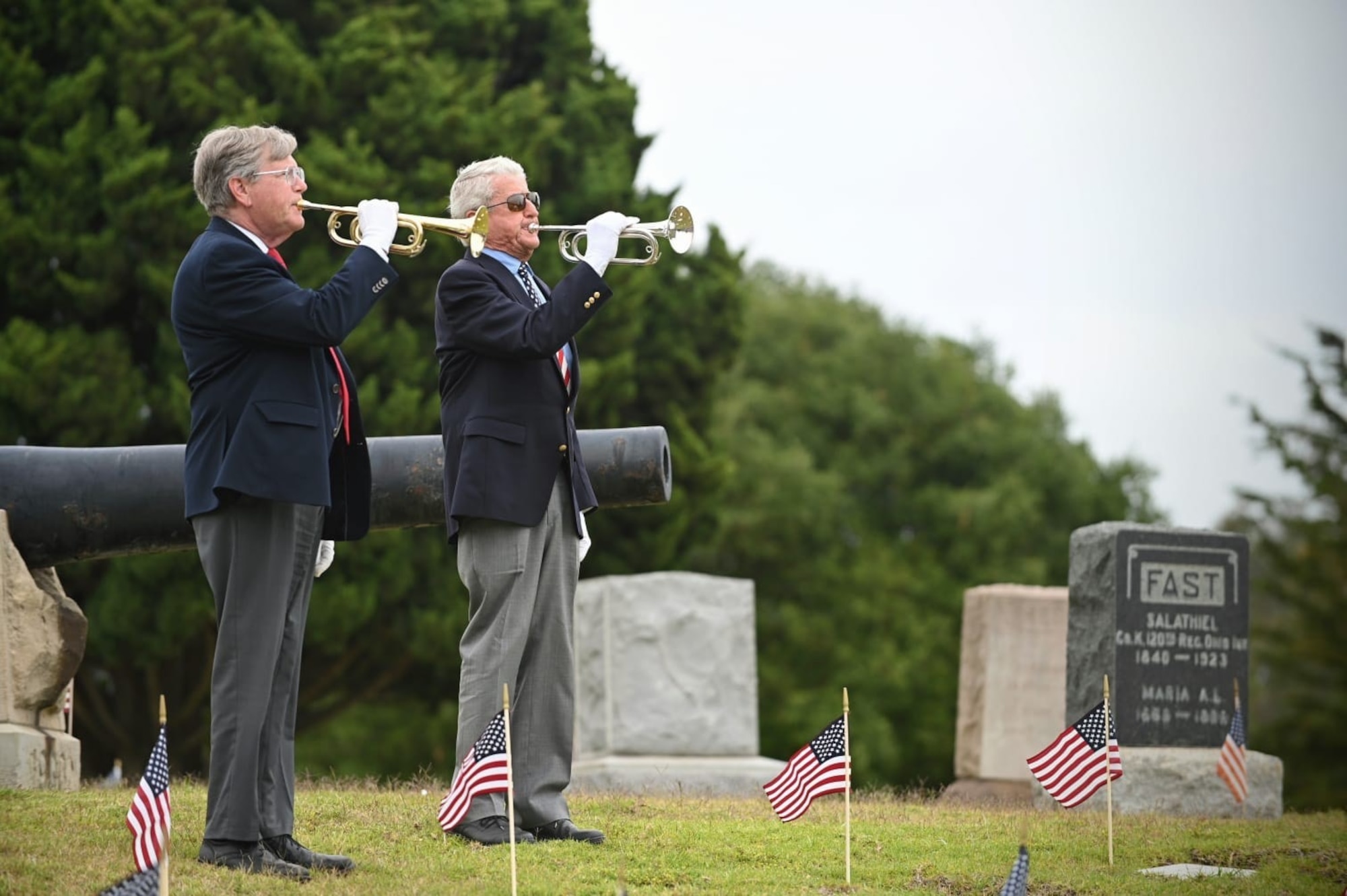 Two buglers sound the melancholic tune of Taps from atop a Santa Barbara Cemetery hill during the annual Memorial Day Ceremony in Santa Barbara, Calif., May 26, 2025. Members in attendance paid their respects to the service of those who gave the ultimate sacrifice in service to our nation. (U.S. Space Force photo by Tech. Sgt. Draeke Layman)