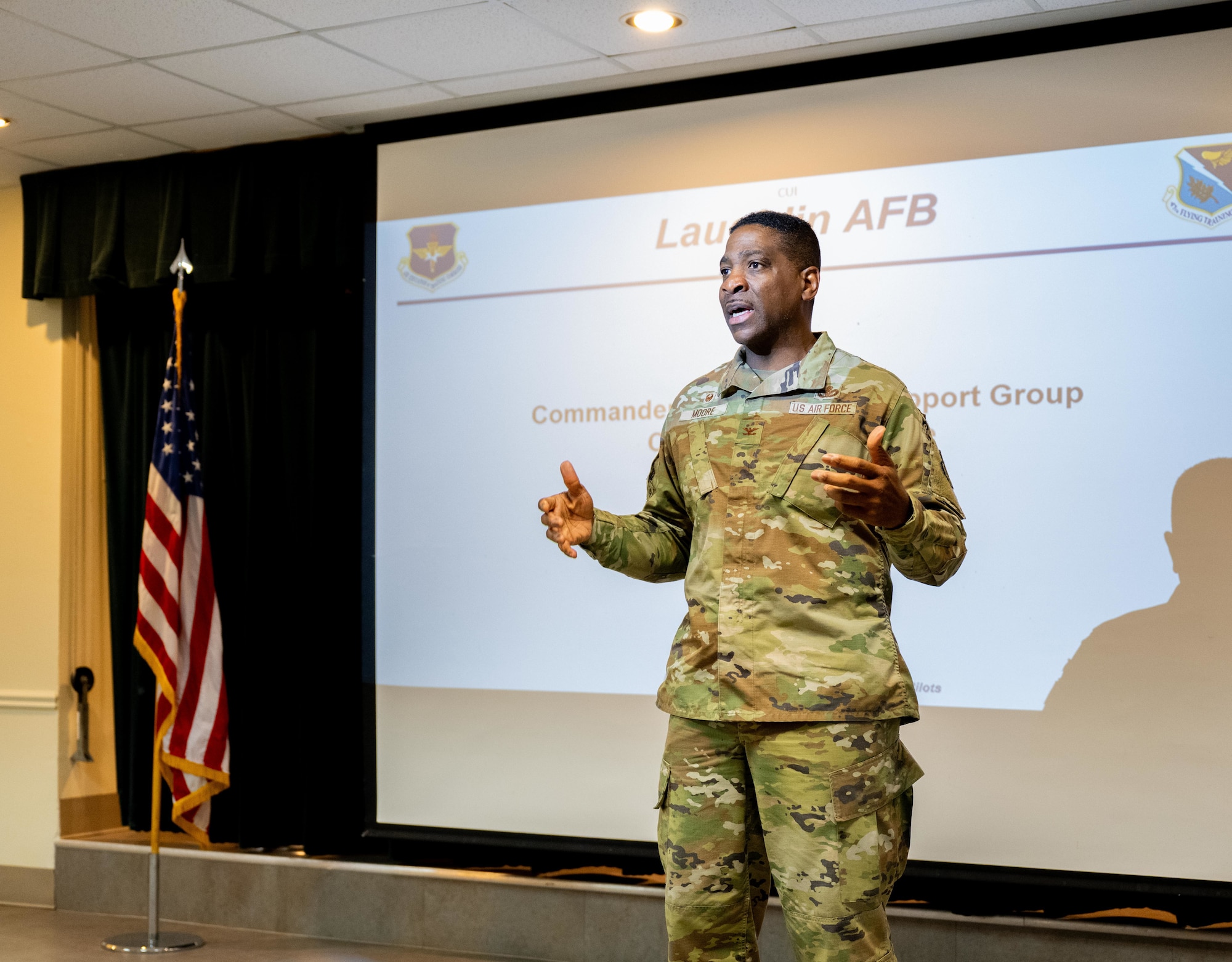 U.S. Air Force Col Robert Moore, 47th Mission Support Squadron, commander, delivers opening remarks during the Small Business Industry Day at Laughlin Air Force Base, Texas, May 21, 2025. The event connected base leadership with local  and regional business representatives to foster partnerships and promote opportunities within the defense contracting space. (U.S. Air Force photo by Airman 1st Class Harrison Sullivan)
